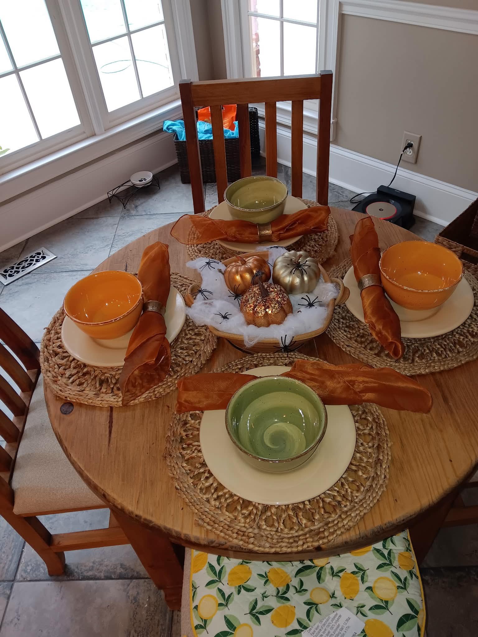 Fall harvest table setting with pumpkin centerpiece