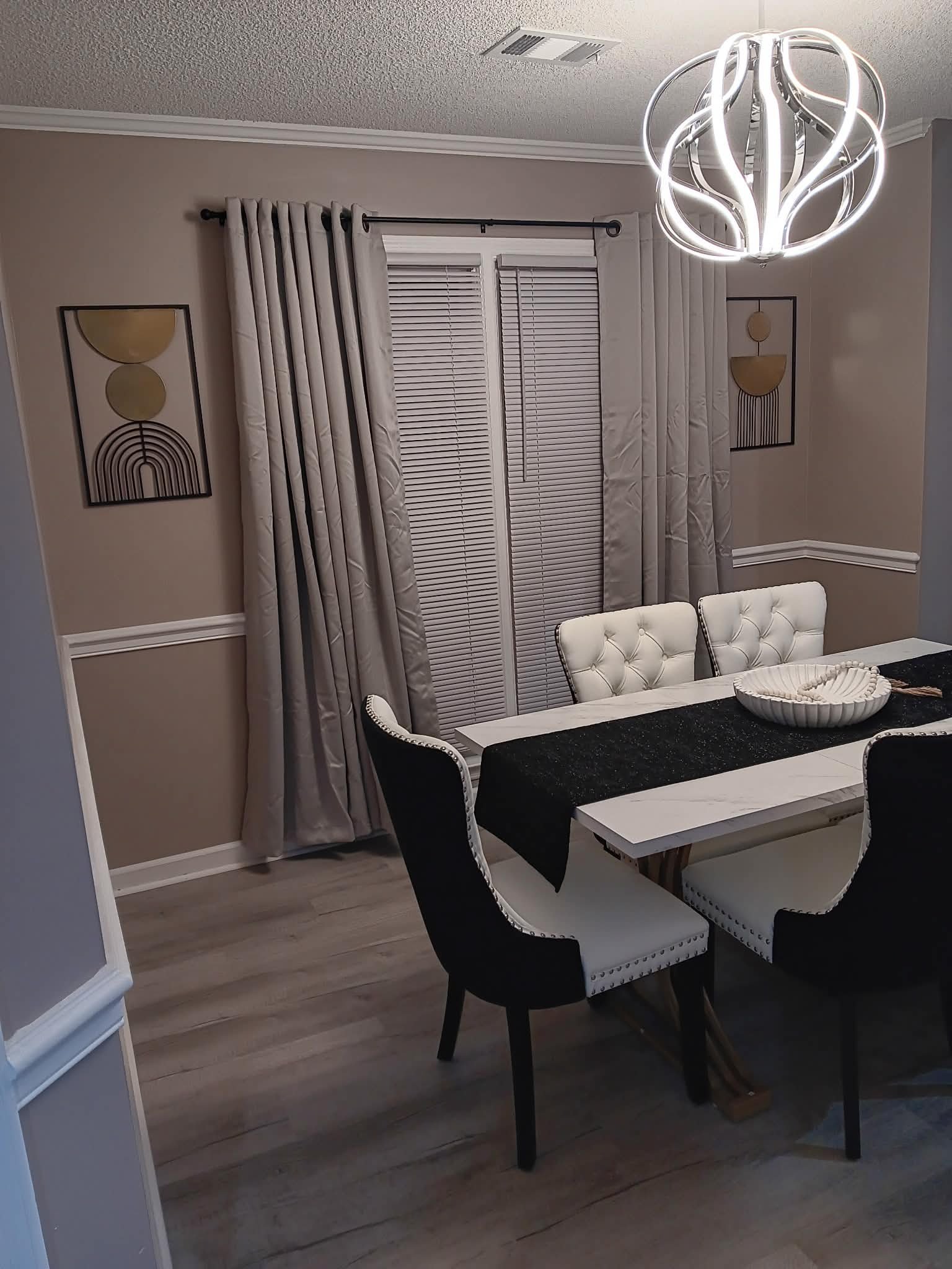 Styled dining room with modern chandelier