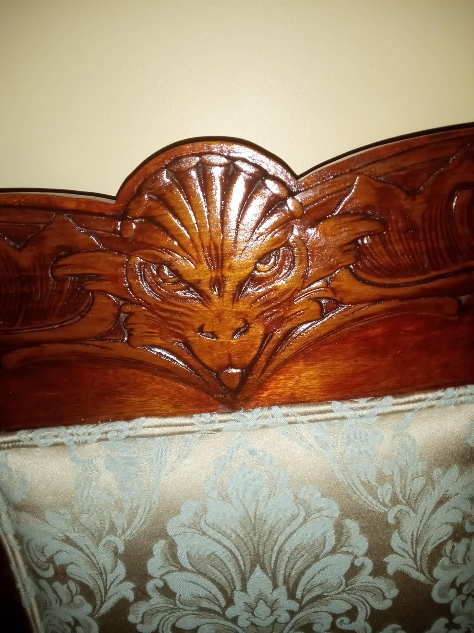 After — carved wood detail on restored chair