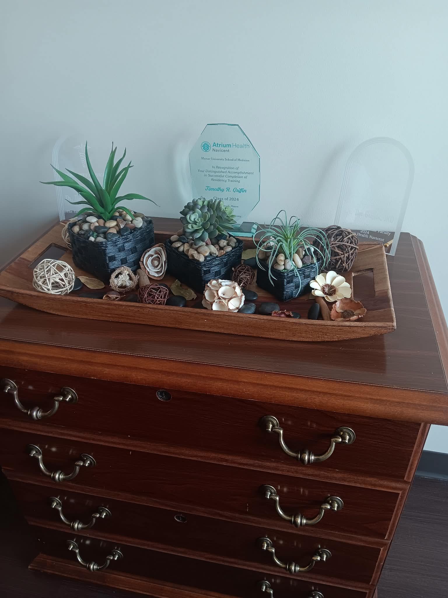 Dresser display with plants and decor