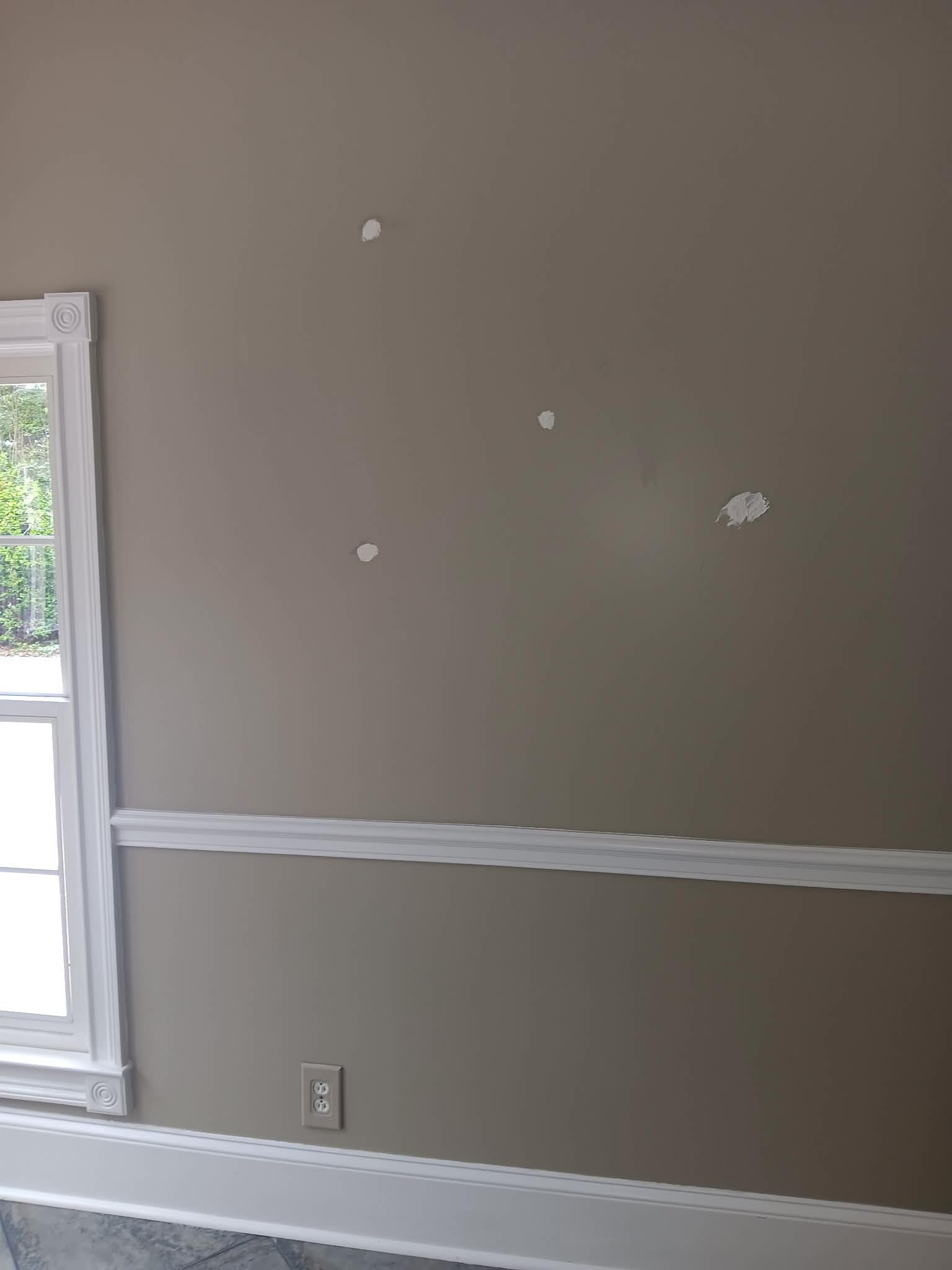 Before — wall with holes