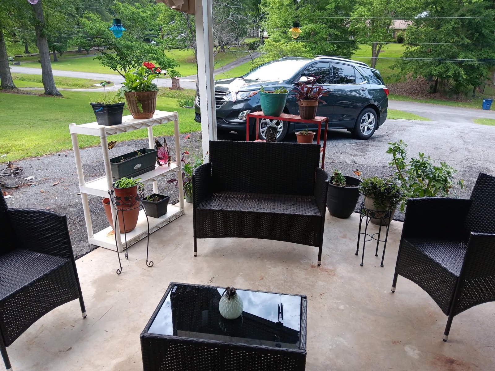 Outdoor patio with furniture and greenery