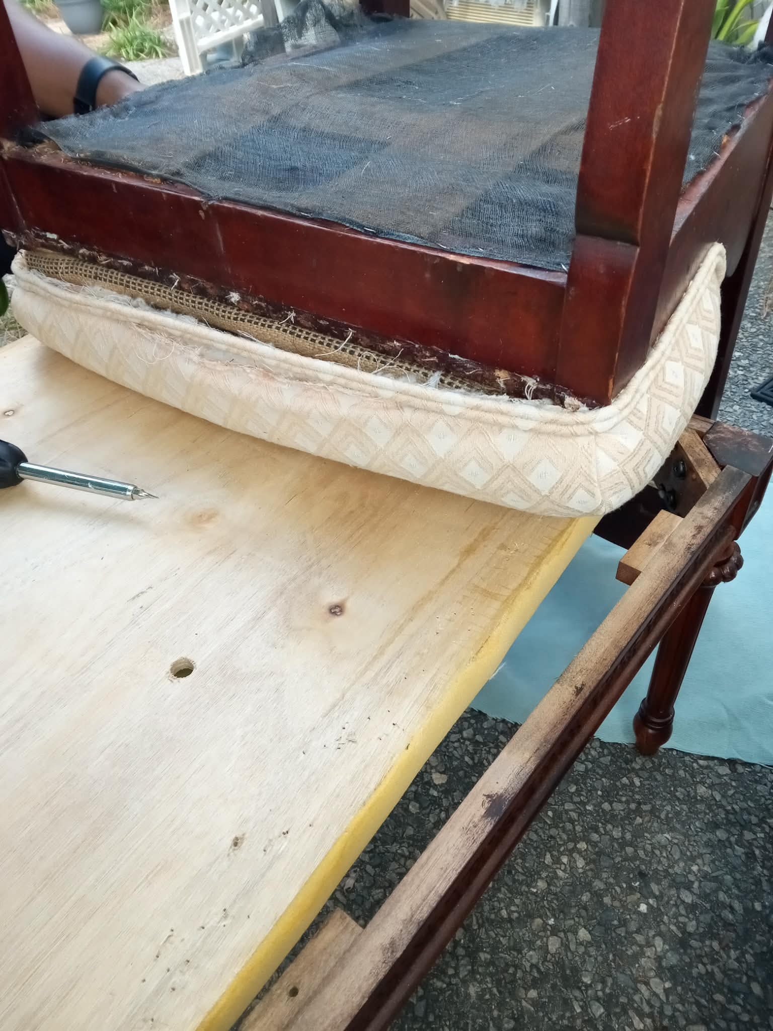 Before — chair being stripped down